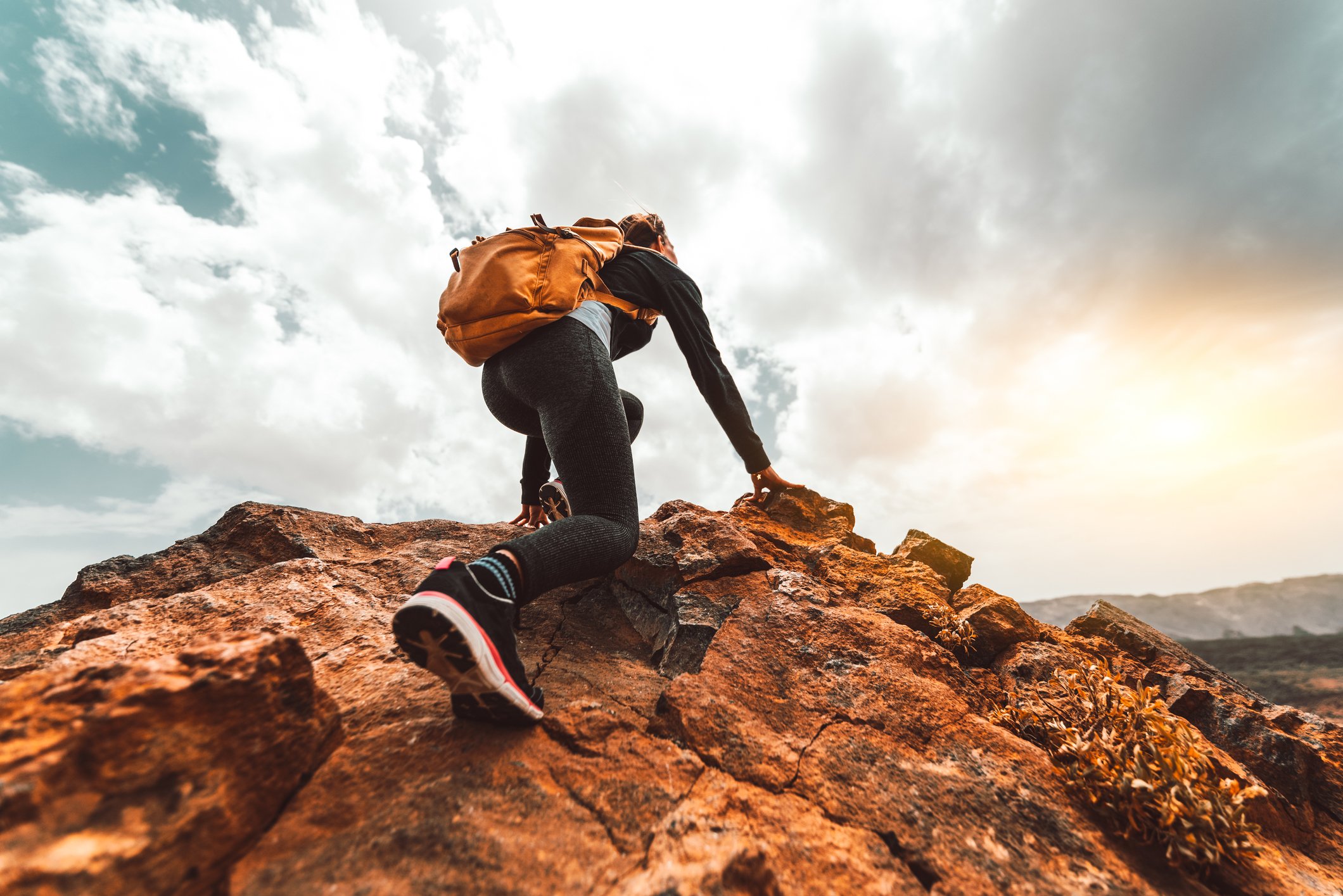 climbing rocky hill